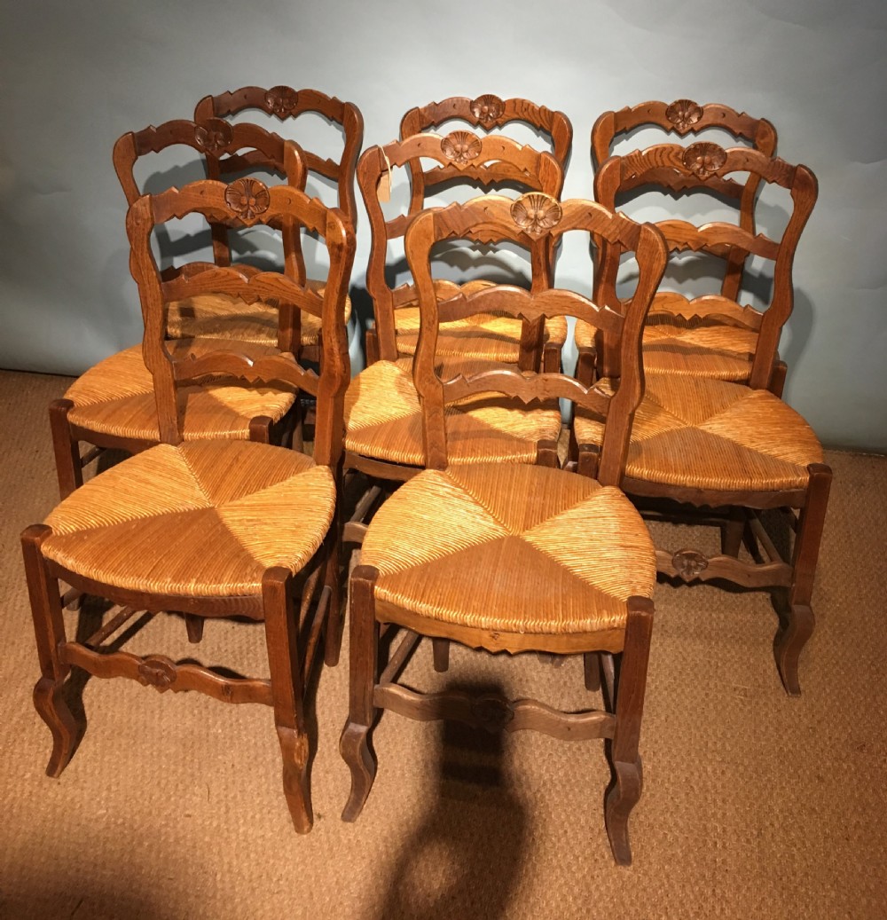 set of 8 oak and rush seated chairs