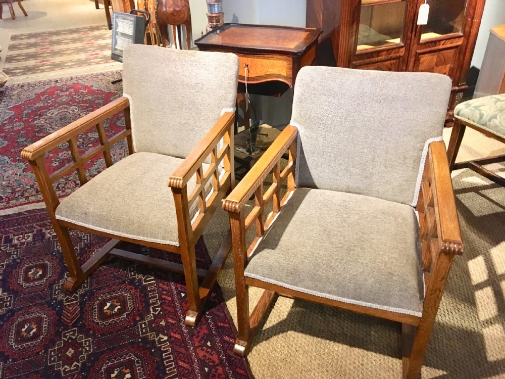 pair arts and crafts cotswold armchairs