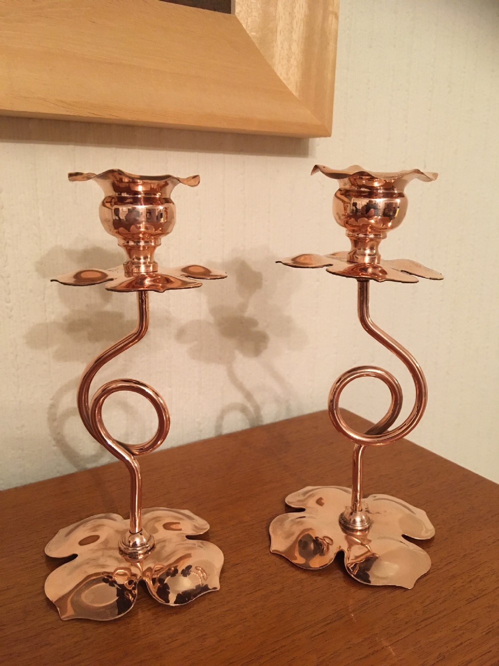 pair of arts and crafts copper candlesticks