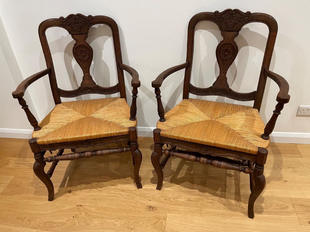large pair of country oak carver chairs